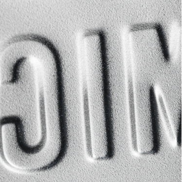 Embossed letters on a textured surface with 